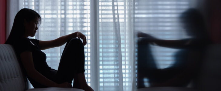 woman on couch alone