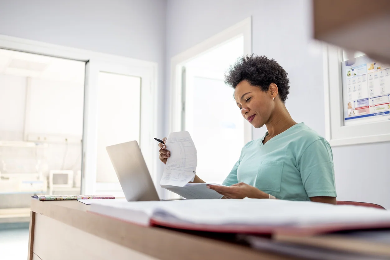 woman reviewing medical records